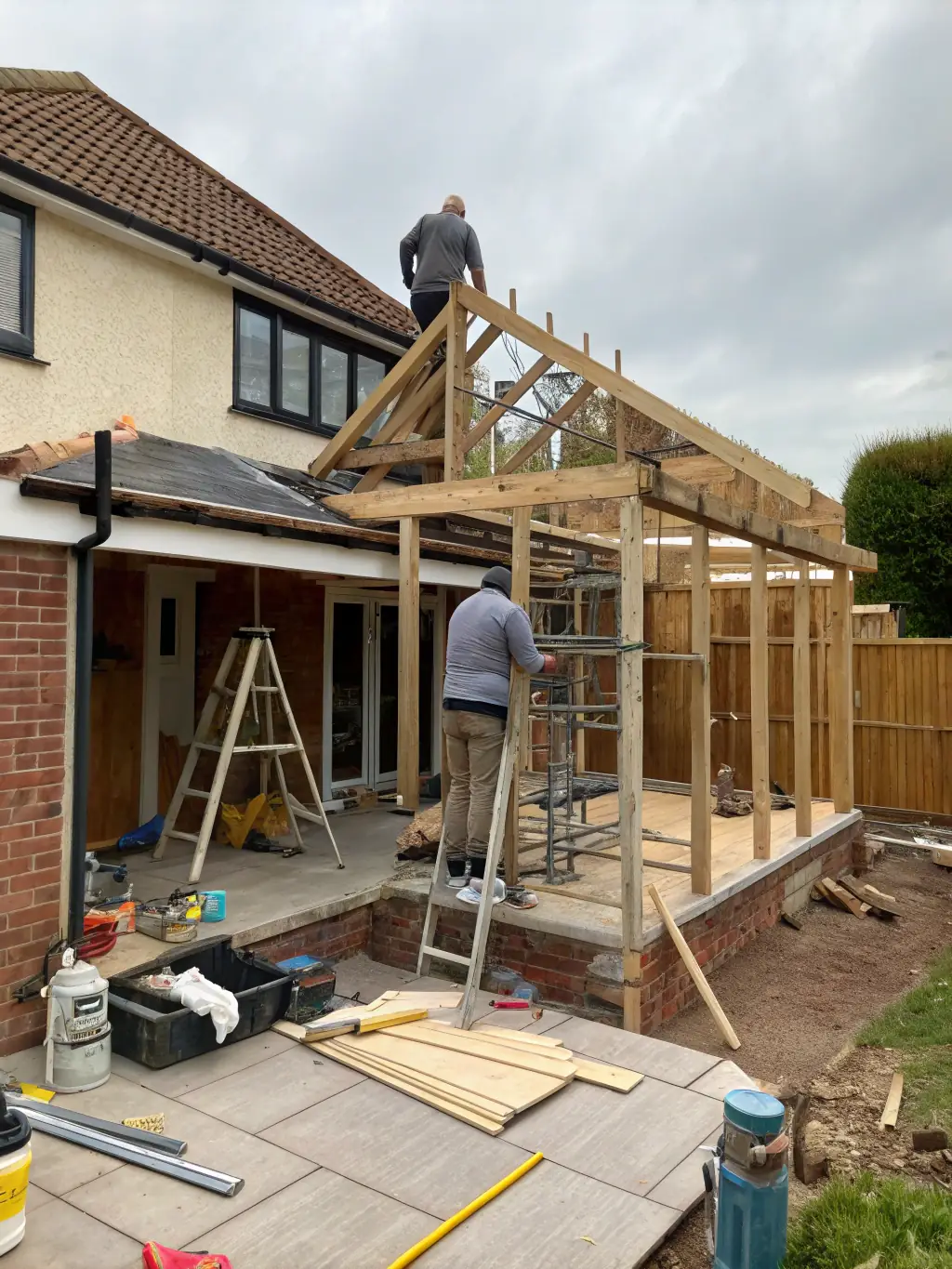 A renovated home with modern features and an extension being added, illustrating Vanderpool Construction Service's renovation and extension services.