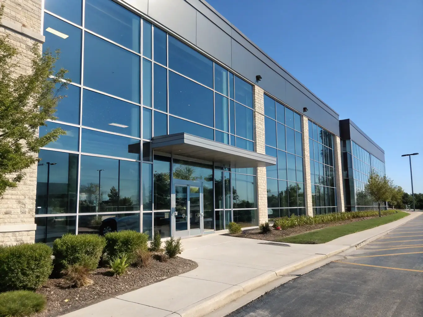 A contemporary commercial building with large glass windows and a sleek design, representing Vanderpool Construction Service's capabilities in commercial construction.